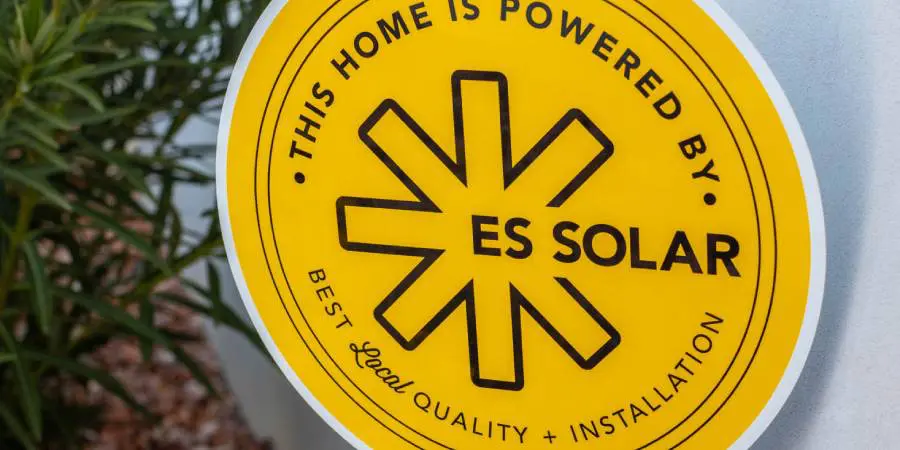 Yellow ES Solar powered home sign.
