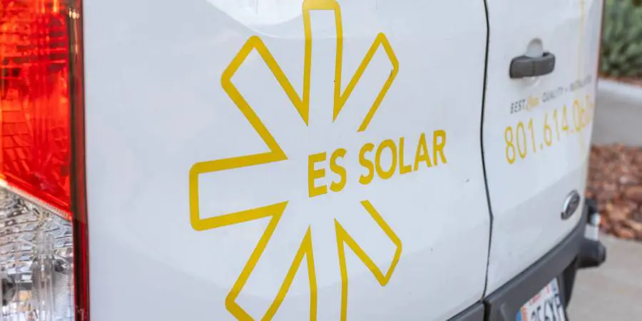 Van with ES Solar logo and contact number.