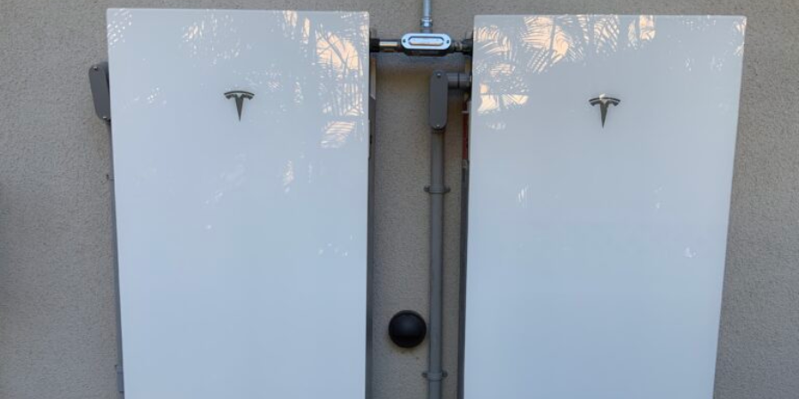 Two white electrical panels on wall.